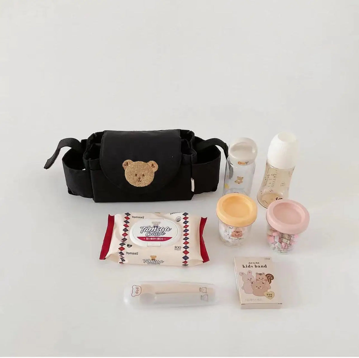 Stroller organizer bag holding bottles, cups and wipes